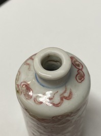 Five Chinese blue, white and copper-red snuff bottles, 18/20th C.