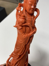 A Chinese carved red coral 'Guanyin' figure, 19/20th C.