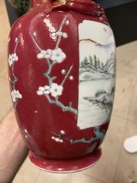 A pair of Chinese famille rose ruby-ground vases, 19th C.