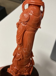 A Chinese carved red coral 'Guanyin' figure, 19/20th C.