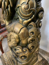 A large Chinese gilded wooden 'dragon' stand, 19th C.