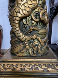 A large Chinese gilded wooden 'dragon' stand, 19th C.