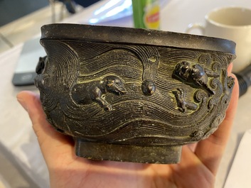 A Chinese bronze 'mythical beasts' censer and cover, 17th C.