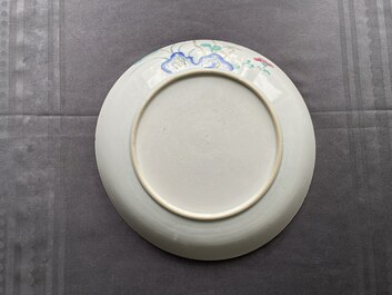 A Chinese famille rose dish and a qianjiang cai plaque signed Wang Ziqing mounted as a screen, Yongzheng and Republic