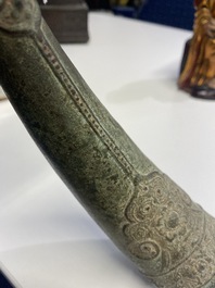 A Vietnamese bronze 'Oliphant' horn or rhyton, L&ecirc; or Mạc dynasty, 15/16th C.