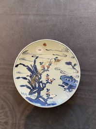 A Chinese blue, white and copper-red ko-sometsuke 'pagoda' plate for the Japanese market, Transitional period