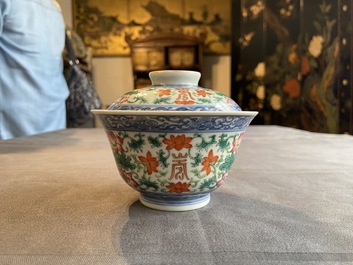 A Chinese famille rose bowl and cover, a 'dragon' plate and a celadon plate, 19th C.