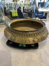 A Tibetan brass ewer, an alms bowl and an Indian bronze ewer, 18/19th C.