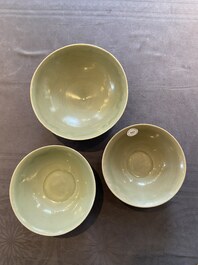 Three Chinese celadon-glazed 'lotus' bowls, Song