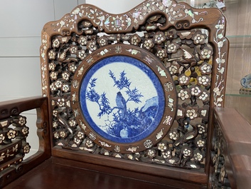 A pair of Chinese mother-of-pearl-inlaid wooden chairs with blue and white porcelain plaques, 19th C.
