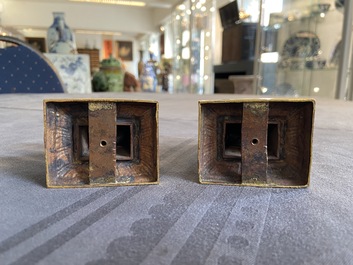 A pair of Chinese gilt bronze Buddhist lions on champlev&eacute; enamel bases, 18/19th C.