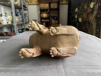 A Chinese Yixing stoneware dog on wooden stand, 19th C