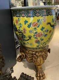 A Chinese yellow-ground famille verte 'dragons' fish bowl on gilded wooden stand, 19th C.