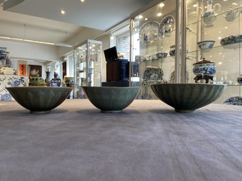 Three Chinese celadon-glazed 'lotus' bowls, Song