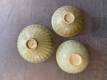 Three Chinese celadon-glazed 'lotus' bowls, Song