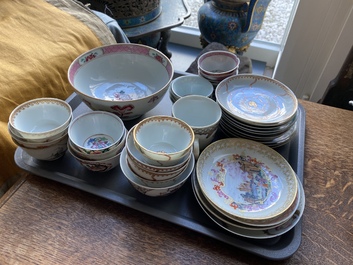 A varied collection of Chinese famille rose and grisaille cups and saucers and a 'rooster' bowl, Yongzheng/Qianlong