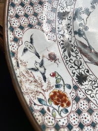 A pair of Chinese Canton enamel 'foreigner' plates, Qianlong