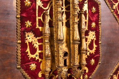 A Spanish walnut 'bargue&ntilde;o' cabinet with red velvet and bronze mounts, 17th C.