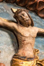 A large Flemish polychrome walnut retable, probably Ghent, dated 1529