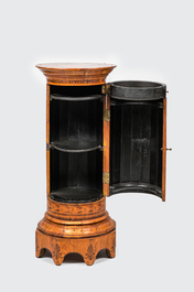 A round inlaid wooden one-door cabinet stand, 19th C.