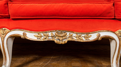 A partly gilt wooden sofa and four armchairs with red velvet upholstery, 18/19th C.