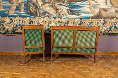 A green-upholstered carved wooden salon set with a two-seater, a fauteuil and three armchairs, 19th C.