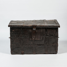 A wrought iron-mounted wooden coffer with leather upholstery, 17th C.