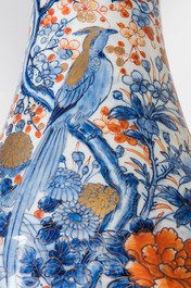 A very large Japanese Imari vase with a bird among blossoming branches, Meiji, 19th C.
