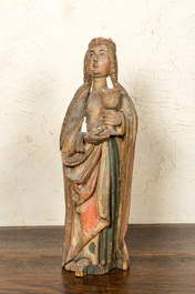 A German polychromed basswooden Saint Odilia holding a chalice, Middle-Rhein area, early 16th C.