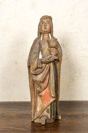 A German polychromed basswooden Saint Odilia holding a chalice, Middle-Rhein area, early 16th C.