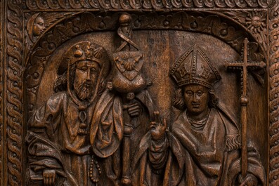 A carved oak panel depicting Saint James with a bishop, The Low Countries, late 15th C.