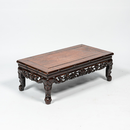 A Chinese hardwood opium table, 20th C.