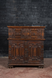 An English Jacobean style carved oak cabinet with two doors beneath a drawer, 17th C. and later