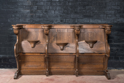 An impressive Flemish oak pew, 18th C.