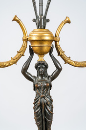 A French gilt and patinated bronze three-light candelabra, 19th C.