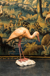 A polychrome plaster ibis on a stone base, 20th C.