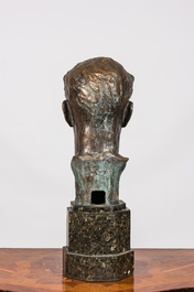 A bronze male bust on a marble base, 20th C.