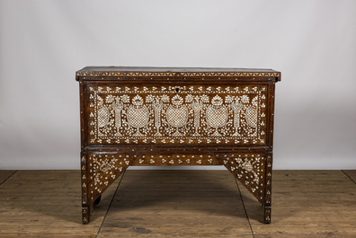 A Syrian mother-of-pearl-inlaid wooden bridal chest on stand, 19th C.