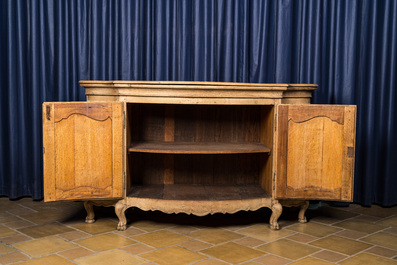 A French oak wooden four-door sideboard, 18/19th C.