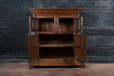 A rare German carved oak sculptural cupboard on diagonal supports with recumbent lions, Westphalia, 16th C.