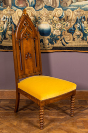 An English Victorian Gothic Revival oak high back arm chair, 19th C.