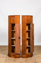 A pair of fluted wooden corner cabinets, 19/20th C.