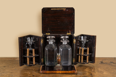 A wooden bone-decorated liqueur cellar with two carafes, two glasses and a travel bottle, 19th C.