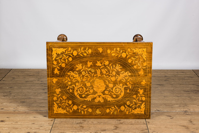A Dutch veneered wooden table with floral marquetry, 19th C.
