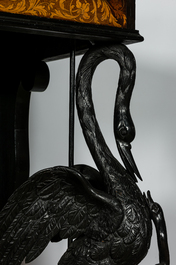 An ebonised and inlaid wooden console with swans, 19th C.