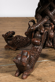 An Anglo-Indian colonial table on a well-carved stand with lions and peacocks, 19th C.