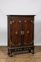 An English colonial brass mounted two-door cabinet, 19th C.