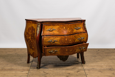A French Louis XV-style rosewood marquetry chest of drawers, 20th C.