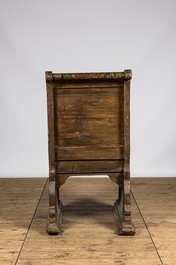 A Russian polychrome wooden ceremonial armchair with an eagle, 19th C.