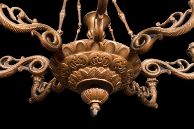 A faux bronze-patinated wooden Louis XV-style chandelier, 20th C.